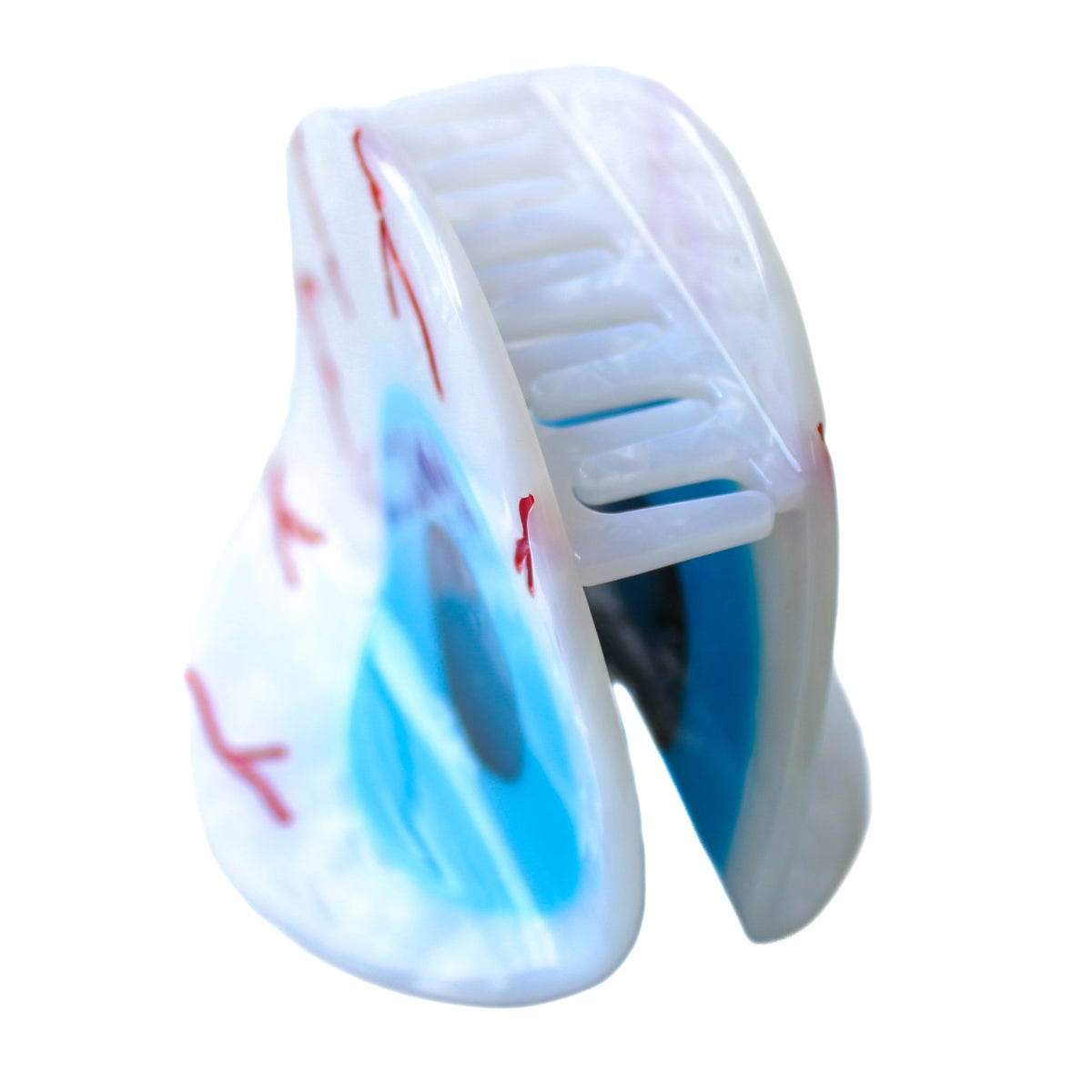 side view of the eyeball hair claw, showing the teeth of the claw