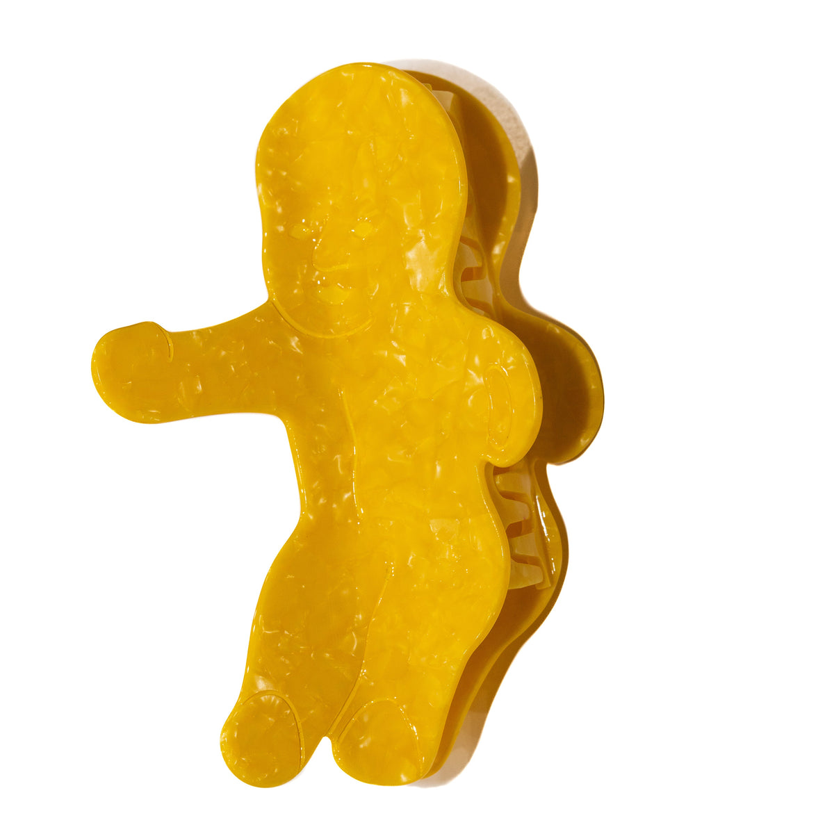 The King Cake Baby Claw in pearly yellow on a plain white background, shaped like a king cake baby figurine with one arm outstretched.