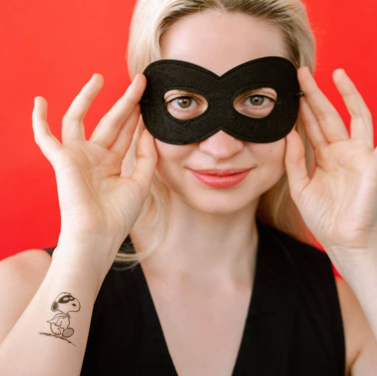 Many Faces of Snoopy Tattoo Tin