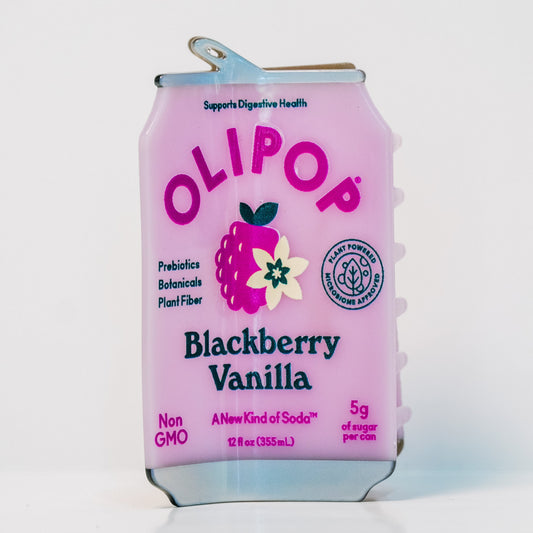 The OLIPOP Blackberry Vanilla can hair claw on a white background: a pale pink can with a blackberry and vanilla flower and the text 'Blackberry Vanilla'