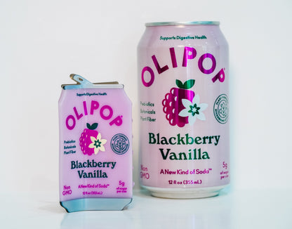 A OLIPOP Blackberry Vanilla hair claw sits next to a real can of Blackberry Vanilla olipop