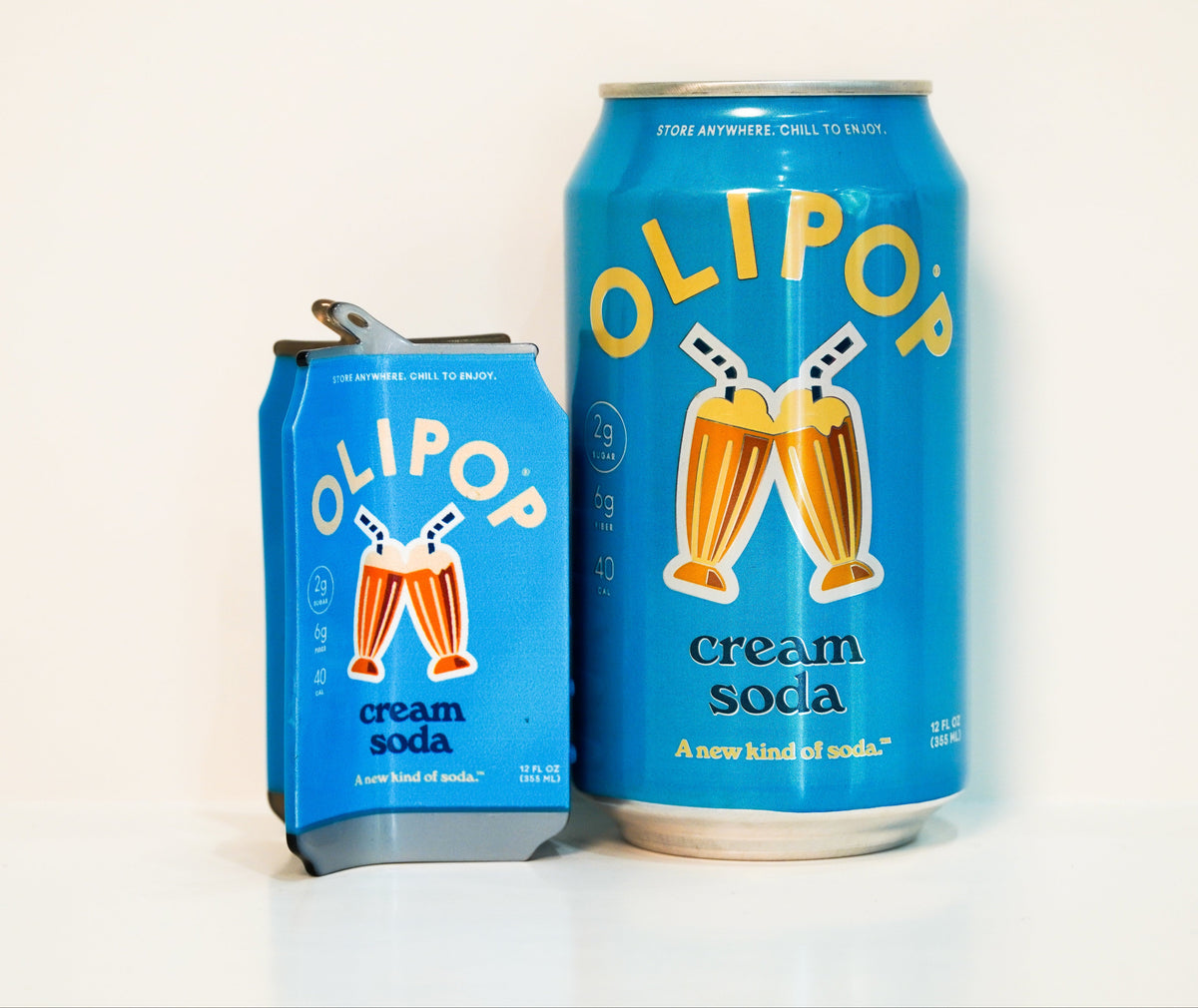 An Olipop Cream Soda hair claw next to a can of Olipop Cream soda