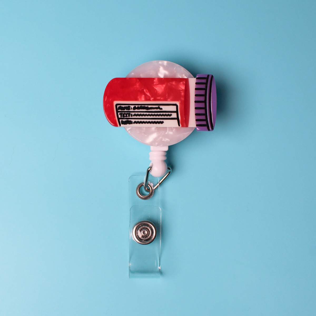 The blood vial badge reel on a blue backround