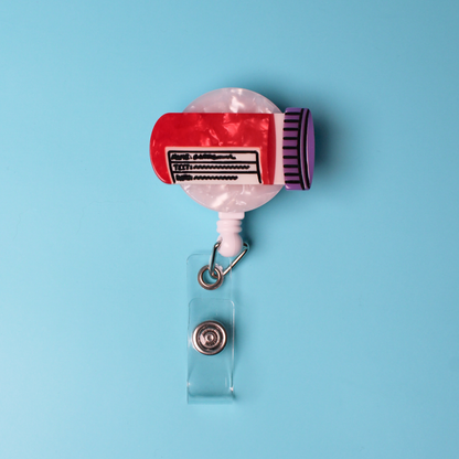 The blood vial badge reel on a blue backround