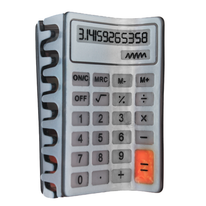 A hair claw shaped like a calculator. The calculator is grey and silver, with an orange equal button. The screen shows the digits of pi on the calculator