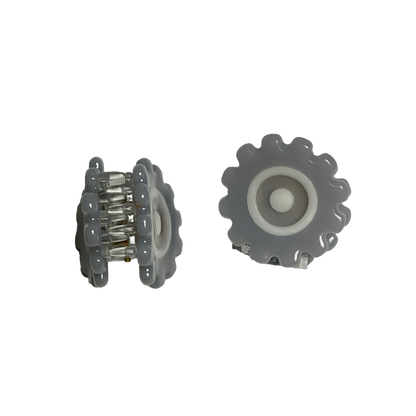 The Engineer Gear Mini Claws, two small grey gear shaped claws with white concentric circles, one shown from the side with the clear spring visible and one from the front.